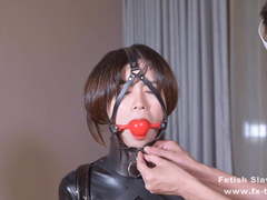 Latex girl on single gloves and gagging